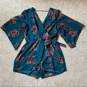 Bailey Blue Flowy Floral Wrap Style Romper